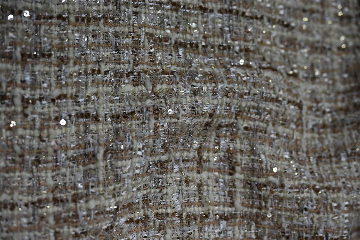Detailed close-up of premium Chanel-style boucl fabric showcasing textured yarns and sequins, ideal for high-end fashion collections. This image represents Fursone's expertise in sourcing tweed fabric and providing rapid sampling with 7-day turnaround for bespoke luxury fabrics.