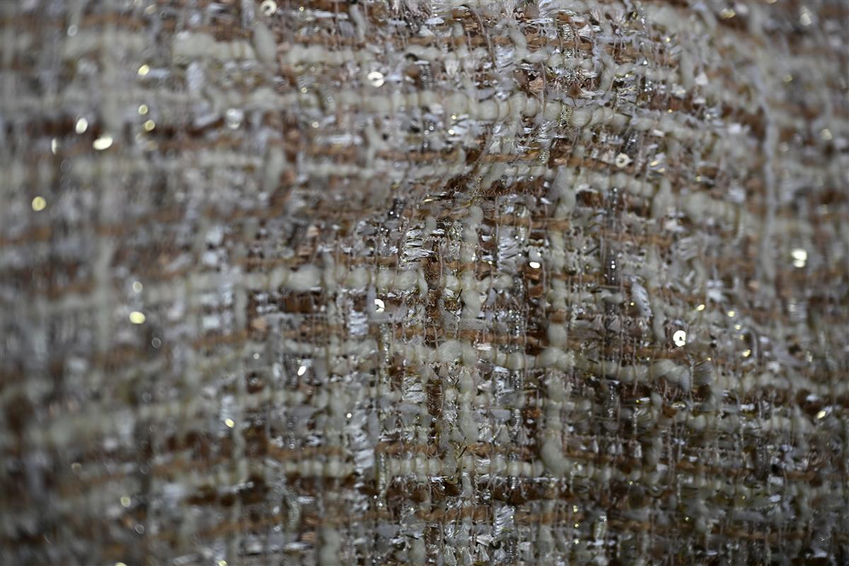 Detailed close-up of premium Chanel-style boucl fabric texture showcasing the intricate weave and subtle sequins, reflecting Fursones expertise in luxury fabric manufacturing from Wenzhou. This fabric exemplifies our commitment to heritage textile craftsmanship and affordable luxury with 100m ready stock and custom bespoke options.