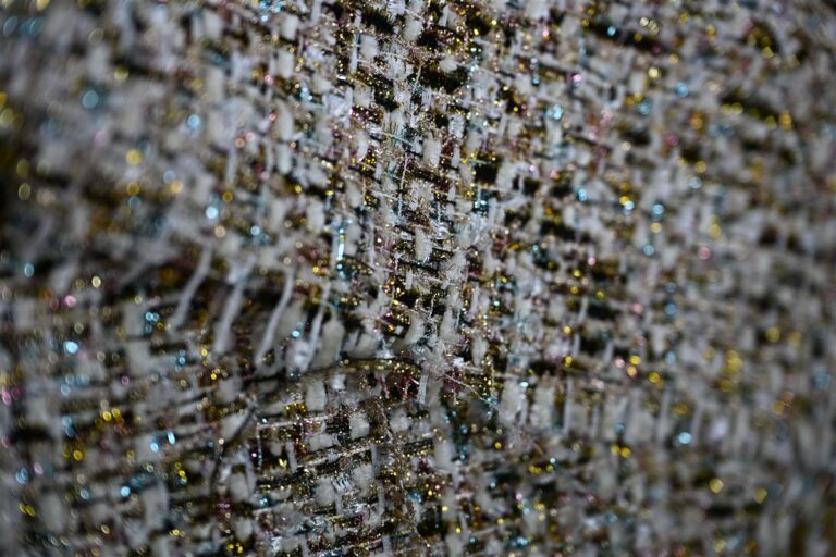 Close-up of premium Chanel-style bouclé fabric showcasing intricate weaving and textured yarns, exemplifying Fursone's expertise in luxury tweed fabric manufacturing. This image highlights the high-quality artisan aesthetic offered through our in-stock and custom MOQ bouclé fabric solutions from Wenzhou textile specialists since 1995.