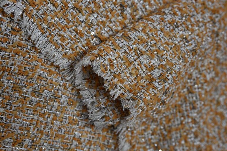 Detailed close-up of premium Chanel-style bouclé fabric showcasing intricate texture and artisan craftsmanship. This fabric highlights Fursone’s expertise in delivering ready stock and custom bespoke solutions from Wenzhou’s heritage textile manufacturing since 1995.