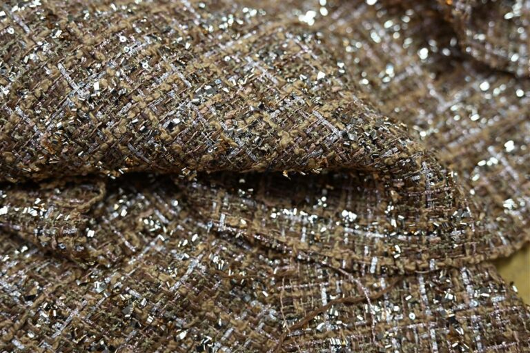 Close-up of premium Chanel-style bouclé fabric featuring intricate metallic threads and textured weaves, showcasing Fursone's expertise in luxury Fabric development from China. Ideal for high-end collections with 1000M custom bespoke options and rapid 7-day sampling.