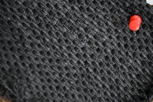 Detailed close-up of intricately woven premium tweed fabric showcasing the artisan yarn texture aligned with Fursone's Chanel-style bouclé fabric manufacturing expertise. This image represents our ready stock and custom bespoke 100m to 1000m fabric solutions for luxury fashion brands sourcing from Wenzhou textile manufacturers.