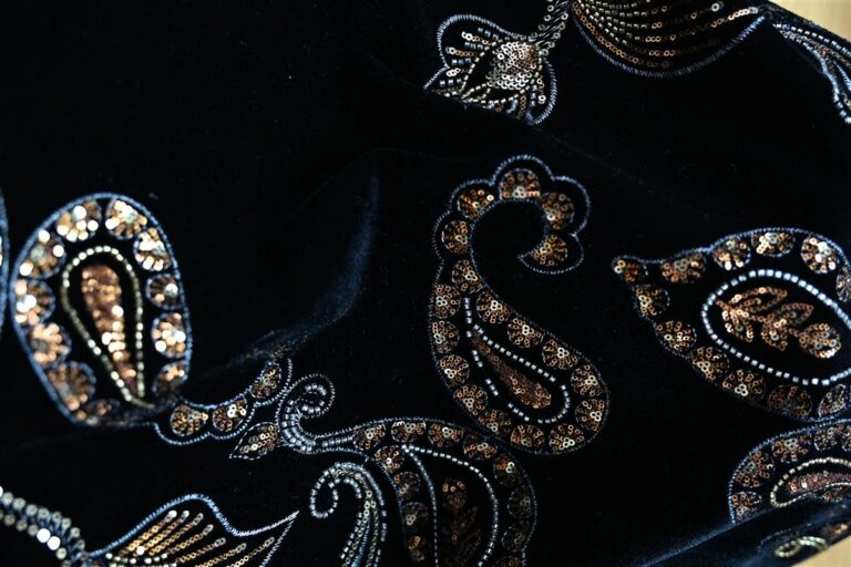 Close-up of black Chanel-style bouclé fabric featuring intricate sequin embellishments that highlight the artisan aesthetic. This premium fabric perfectly represents Fursone's expertise in providing ready stock for luxury fashion brands with rapid sampling and custom bespoke options.