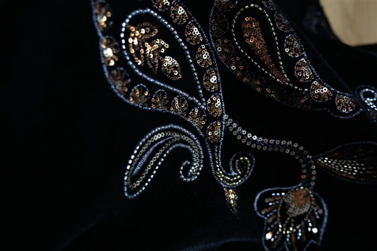 Close-up of premium Chanel-style bouclé fabric with detailed sequin embellishments showcasing artisan craftsmanship and luxurious texture. This image embodies Fursone's expertise in sourcing tweed fabric with Fursone, offering high-quality, rapid sampling and ready stock solutions for luxury fashion brands.