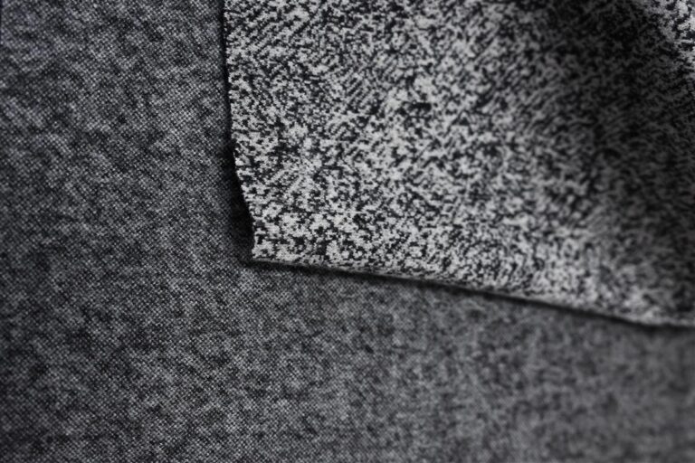 Detailed close-up of premium Chanel-style bouclé fabric showcasing intricate texture and craftsmanship, reflecting Fursone's expertise in heritage knit fabric manufacturing. This image highlights our commitment to rapid sampling with 7-day turnaround for custom fabric development tailored to high-end fashion collections.