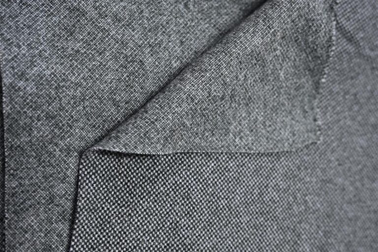 Close-up image of premium Chanel-style bouclé fabric showcasing detailed texture and weave, representing Fursone's expertise in sourcing luxury tweed fabric from China. Ideal for fashion brands seeking ready stock from 1 roll or 1000m custom bespoke luxury fabric solutions.