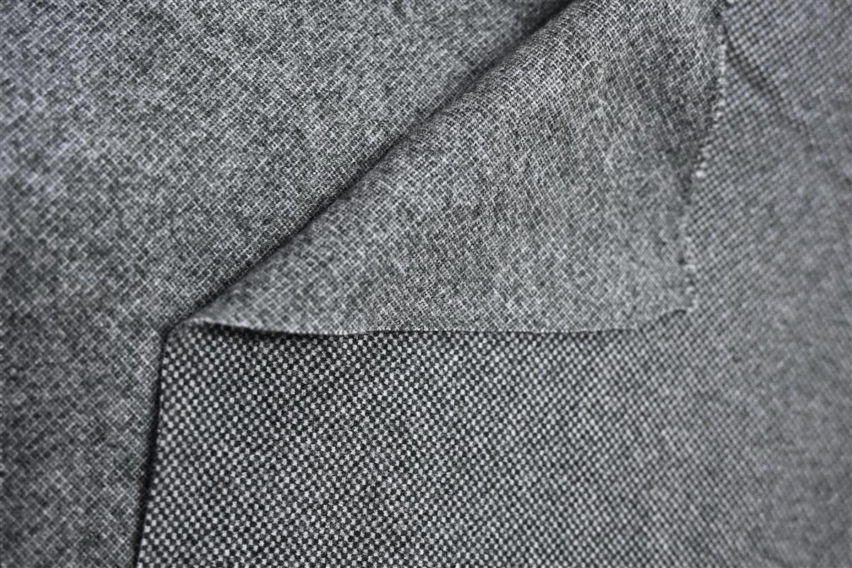 Close-up of premium Chanel-style boucl fabric showcasing intricate texture and weave, highlighting Fursone's expertise in knit fabric manufacturing and heritage cable knits. This image exemplifies our commitment to affordable luxury fabric with rapid sampling and custom bespoke development.