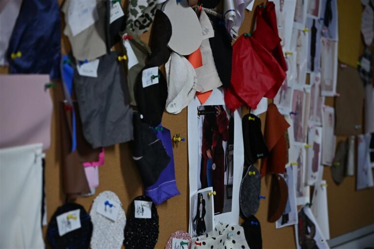 Close-up of a fabric swatch board featuring various Chanel-style bouclé and knit fabric samples pinned for selection, illustrating Fursone's expertise in custom bespoke fabric development with rapid sampling for luxury fashion brands.
