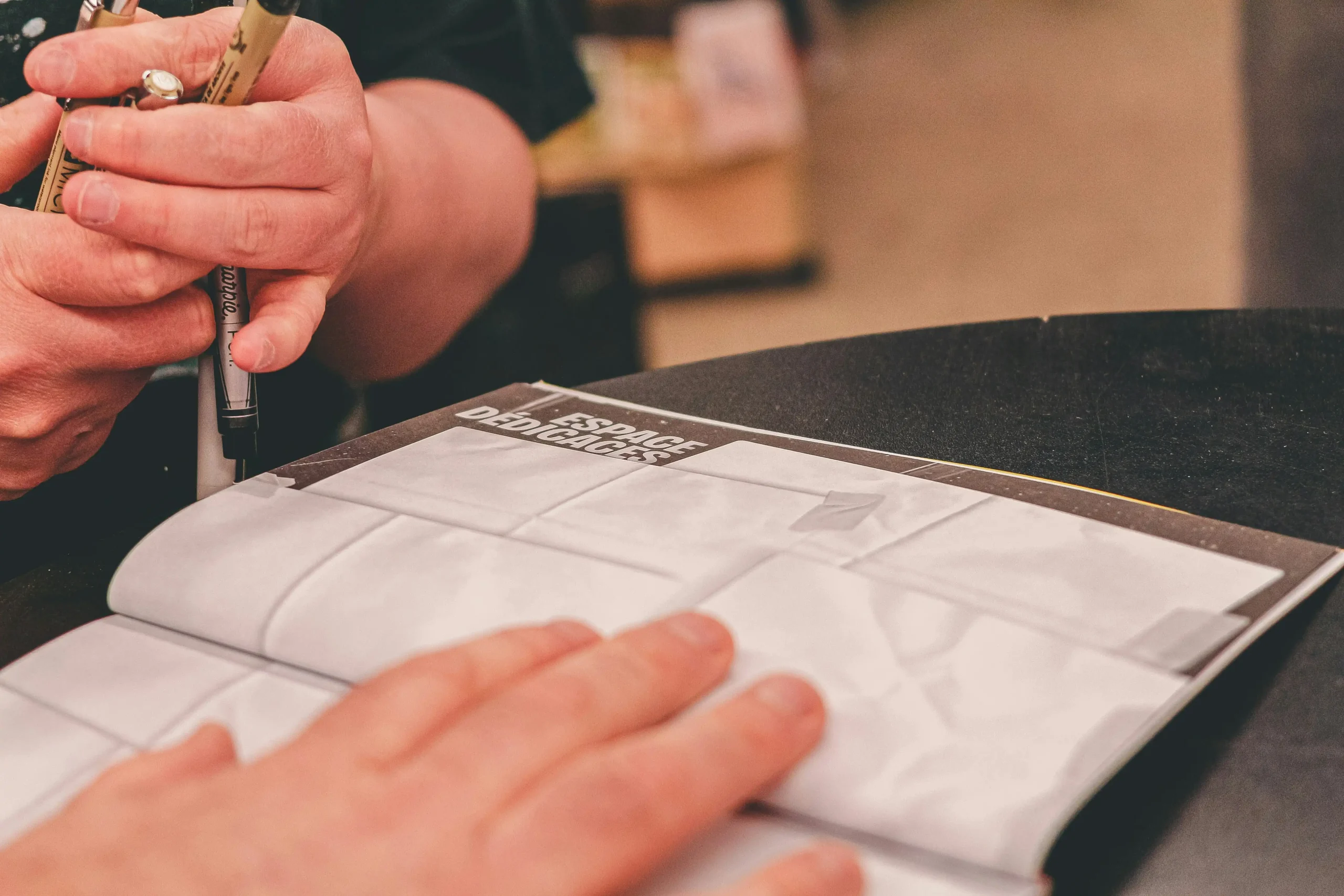 designer examining fabric swatch collection